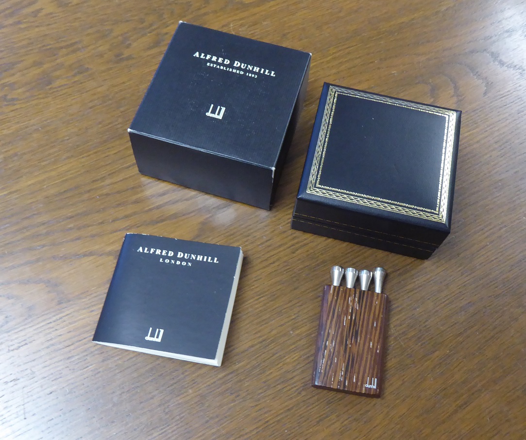 An Alfred Dunhill Sterling Silver Golf Tee Set