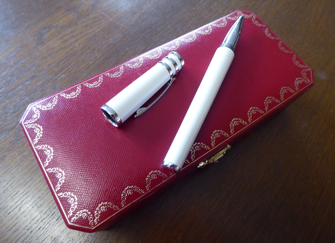 A Cartier Trinity De Cartier White Lacquer Rollerball Pen