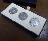 An Alfred Dunhill Yes / No Sterling Silver Coin Set