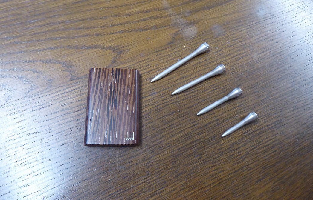 An Alfred Dunhill Sterling Silver Golf Tee Set