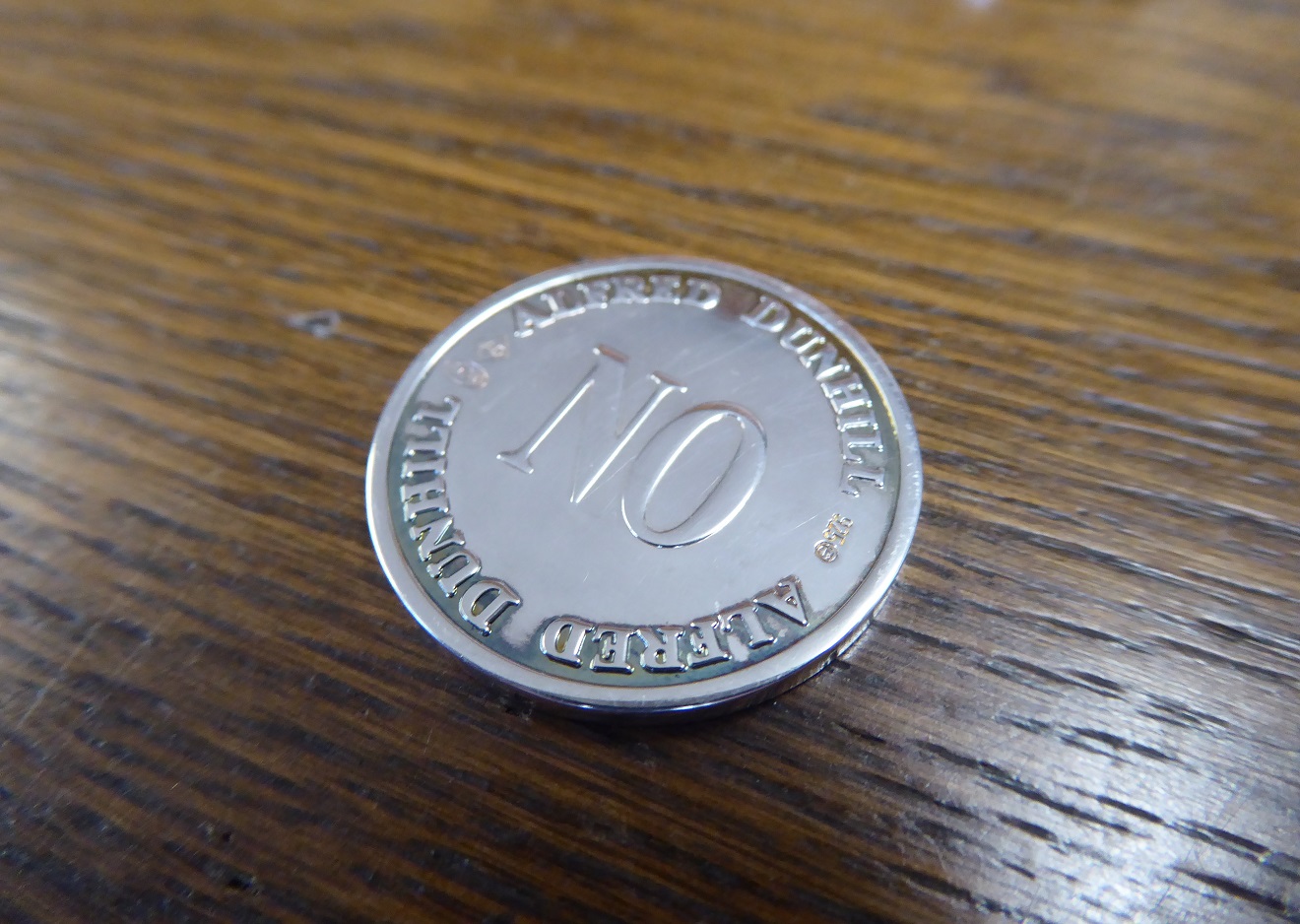 An Alfred Dunhill Yes / No Sterling Silver Coin Set