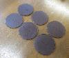 A Set Of Six Baume & Mercier Leather Coasters