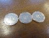 An Alfred Dunhill Yes / No Sterling Silver Coin Set