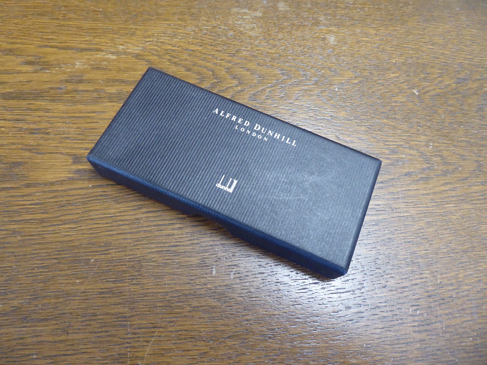 An Alfred Dunhill Yes / No Sterling Silver Coin Set